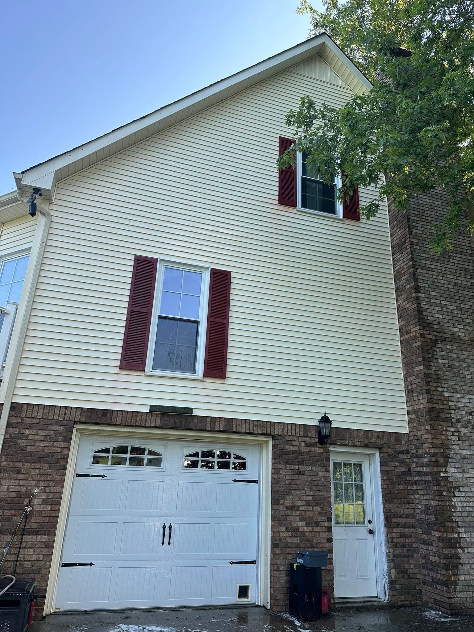 The same garage gable clean and even after the house wash