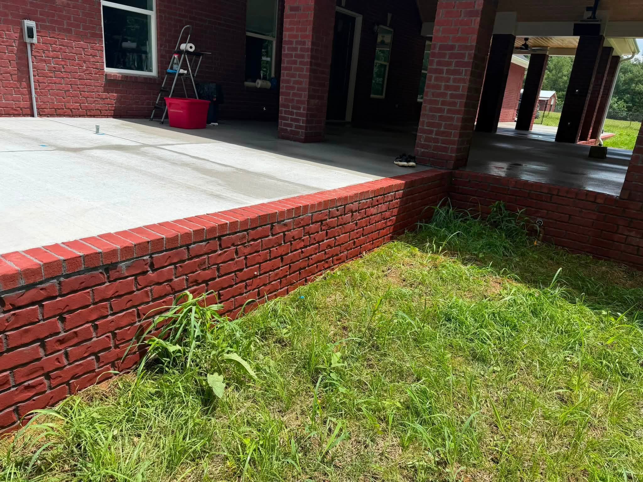 A brick porch wall after the house wash