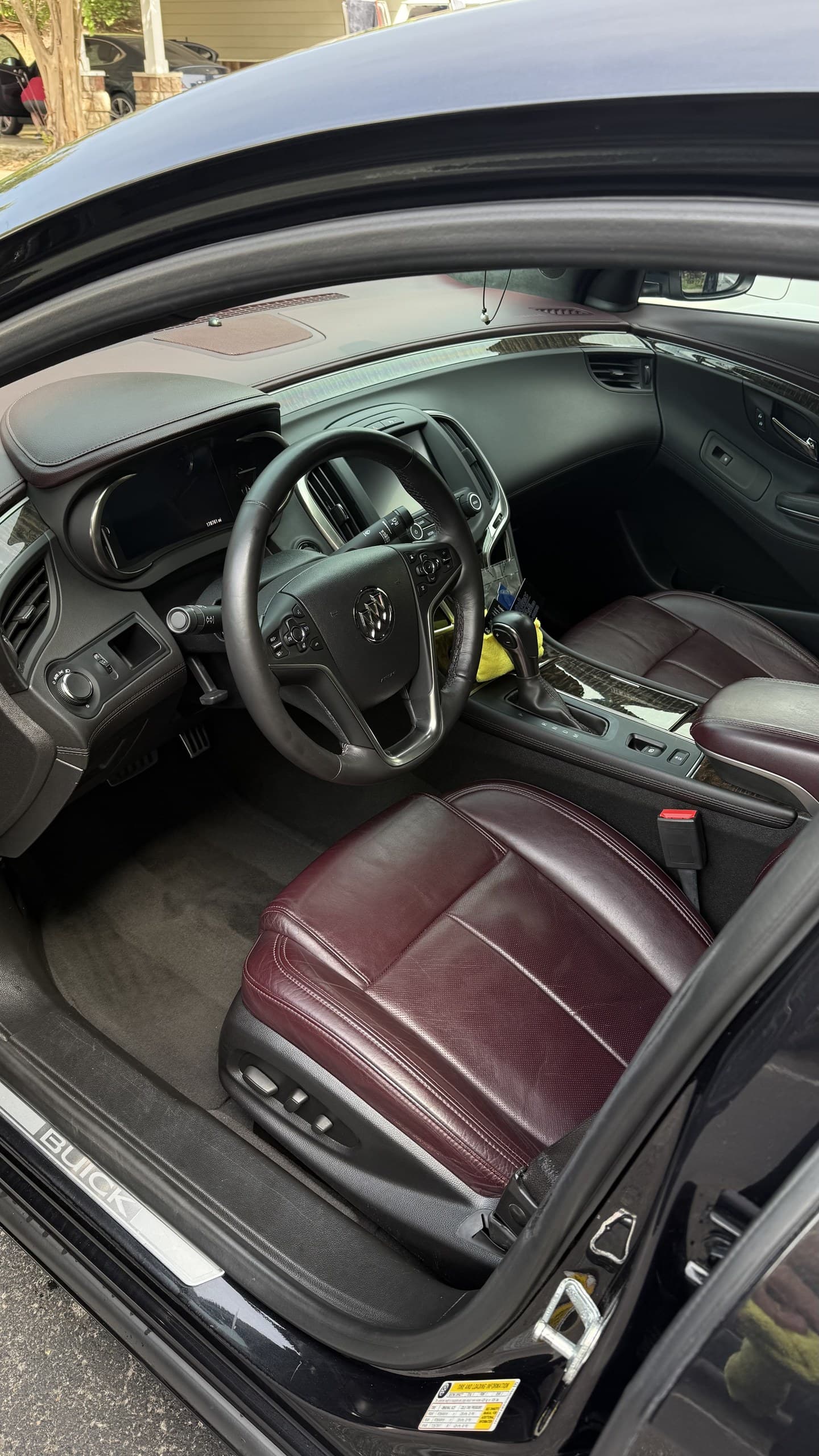 A cleaned and conditioned burgundy leather interior, driver side