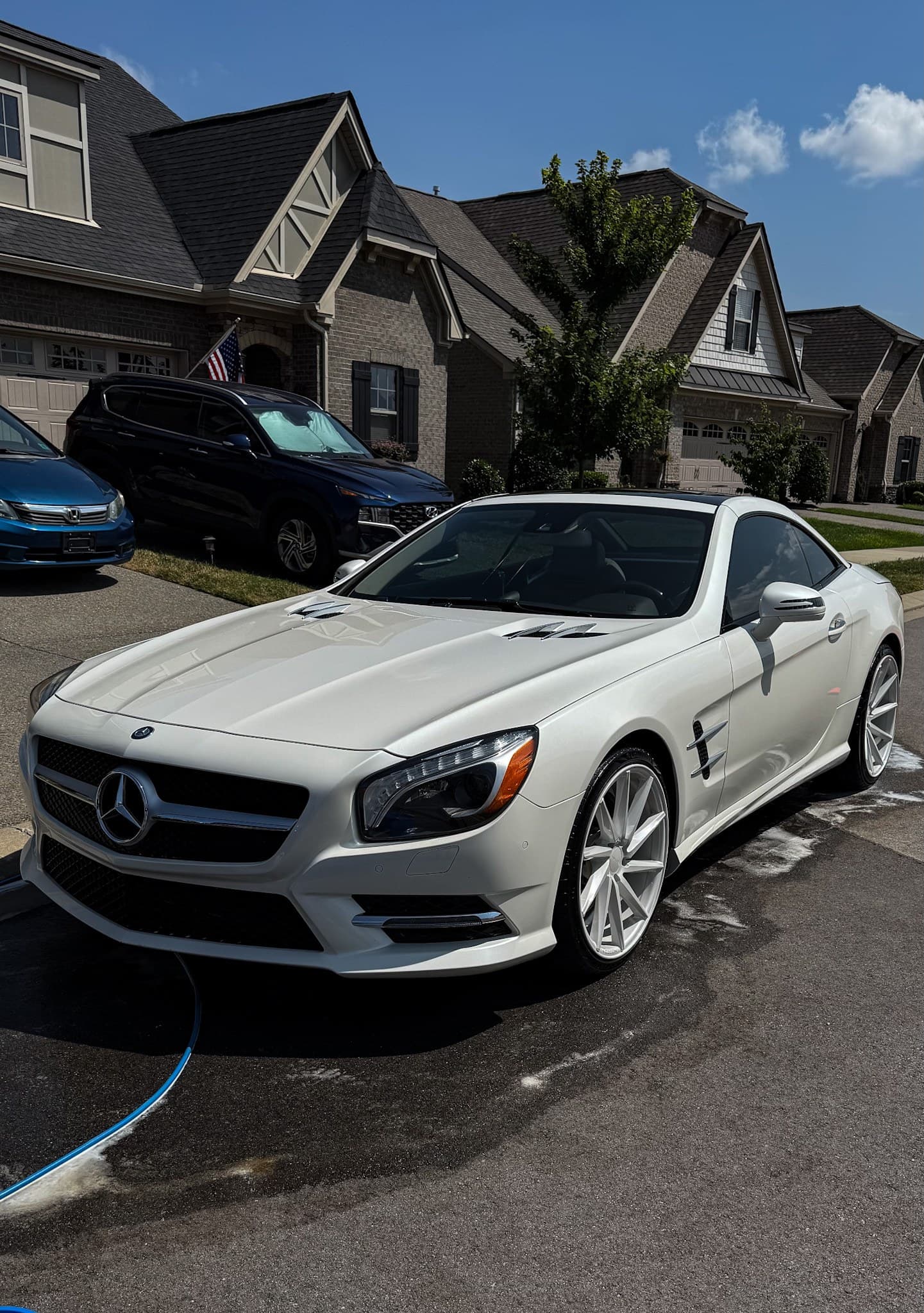 A silver Mercedes convertible finished on a customer’s driveway