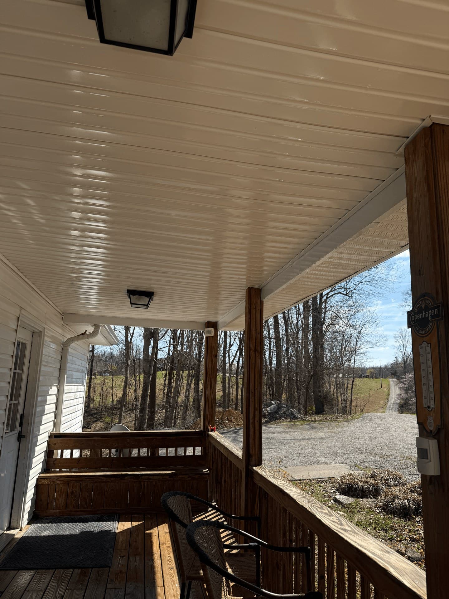 A covered porch and its ceiling after a low pressure wash
